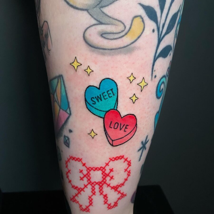 Colorful candy heart tattoos with playful vibes Tattoo on skin
