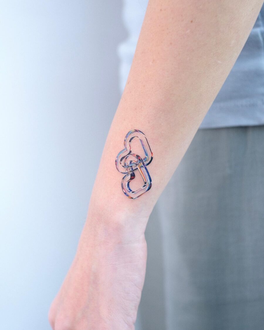 Playful candy heart tattoo design on arm Tattoo on skin