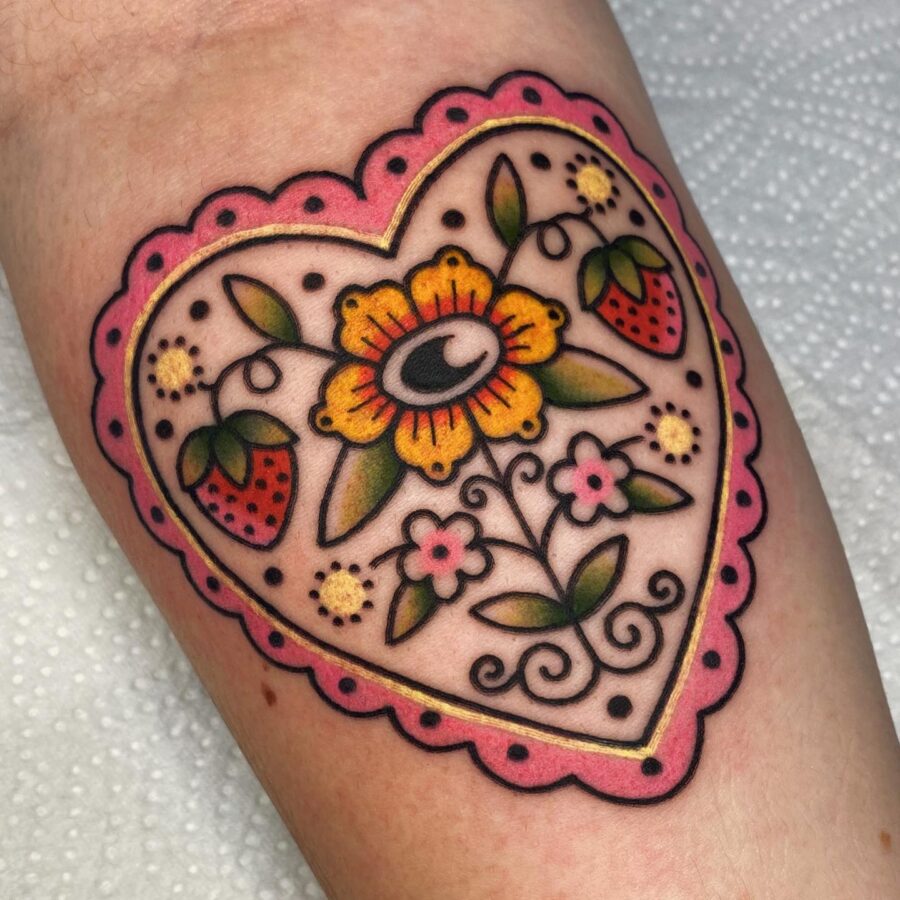 Vibrant Candy Heart Tattoo with Floral Design Tattoo on skin