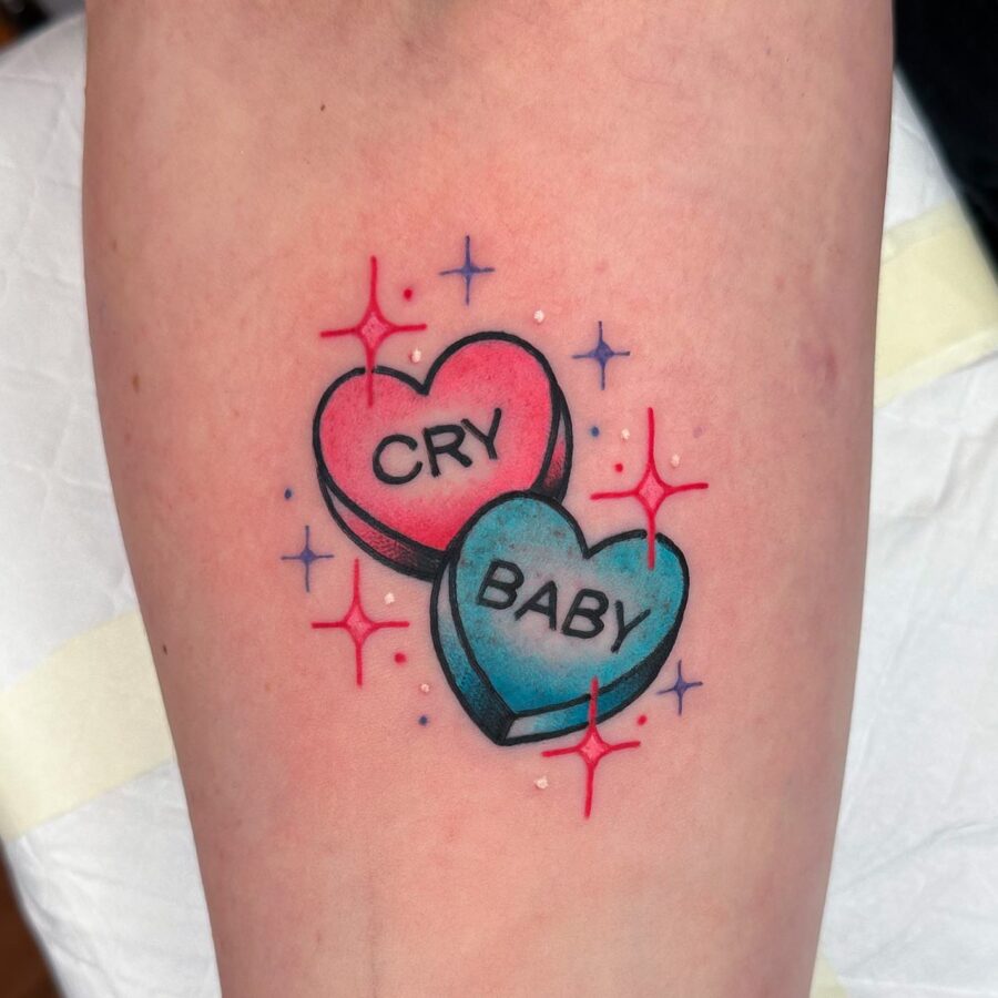 Whimsical candy hearts with playful phrases Tattoo on skin