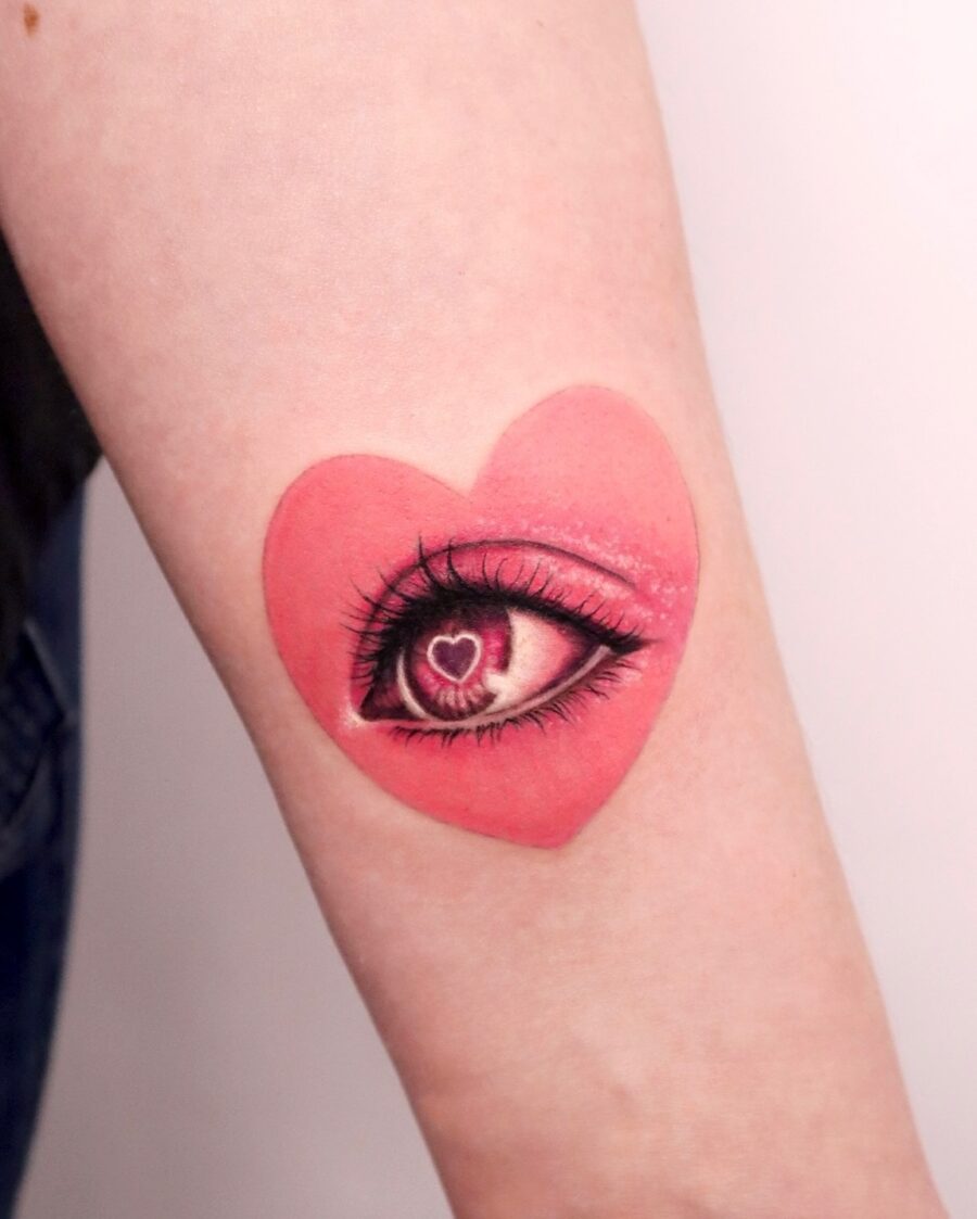Whimsical heart-shaped eye tattoo design Tattoo on skin