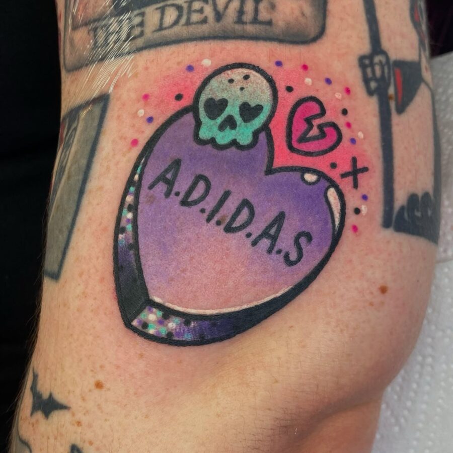 Whimsical skull candy heart tattoo design Tattoo on skin