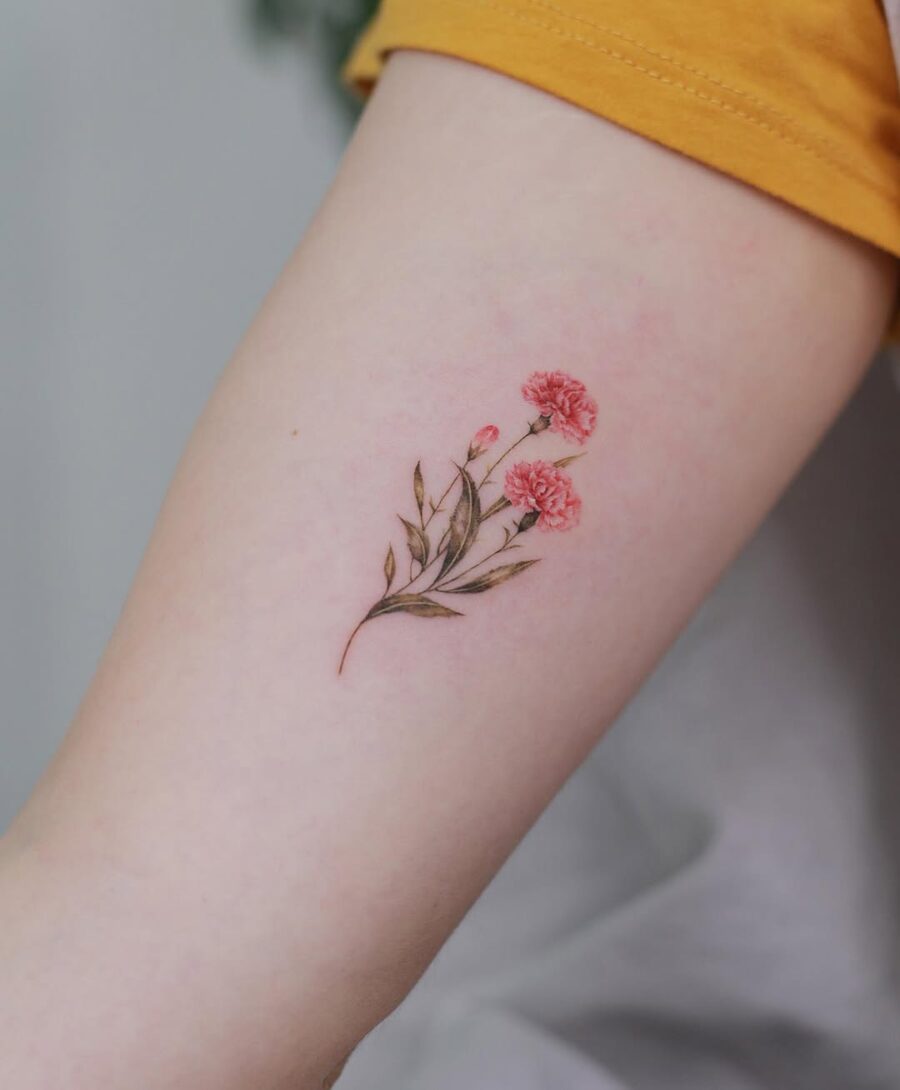 Delicate carnation tattoo on bare skin Tattoo on skin