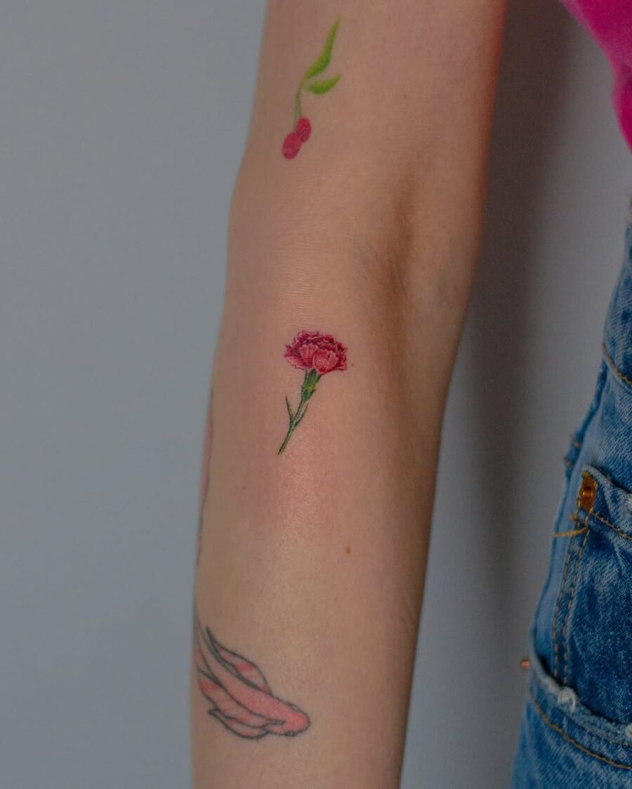 Delicate carnation tattoo with vibrant details carnation tattoos
