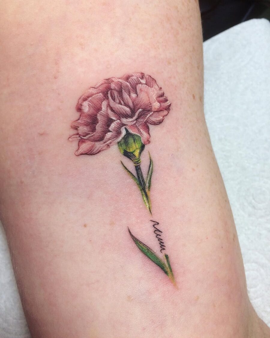 Elegant pink carnation tattoo design for floral lovers Tattoo on skin