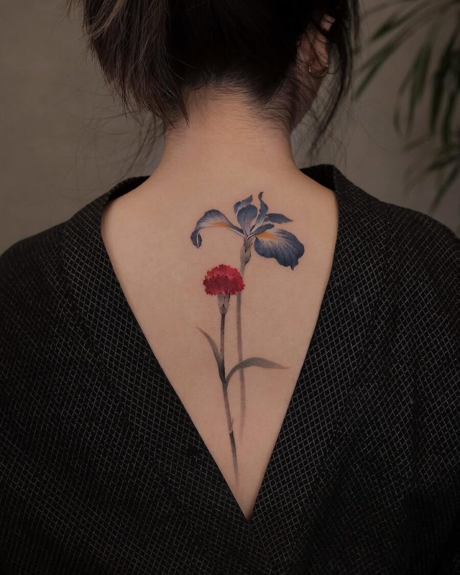 Stunning Carnation Inked on Back Tattoo on skin