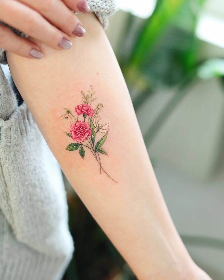 Stunning Carnation Tattoo with Floral Elements Tattoo on skin