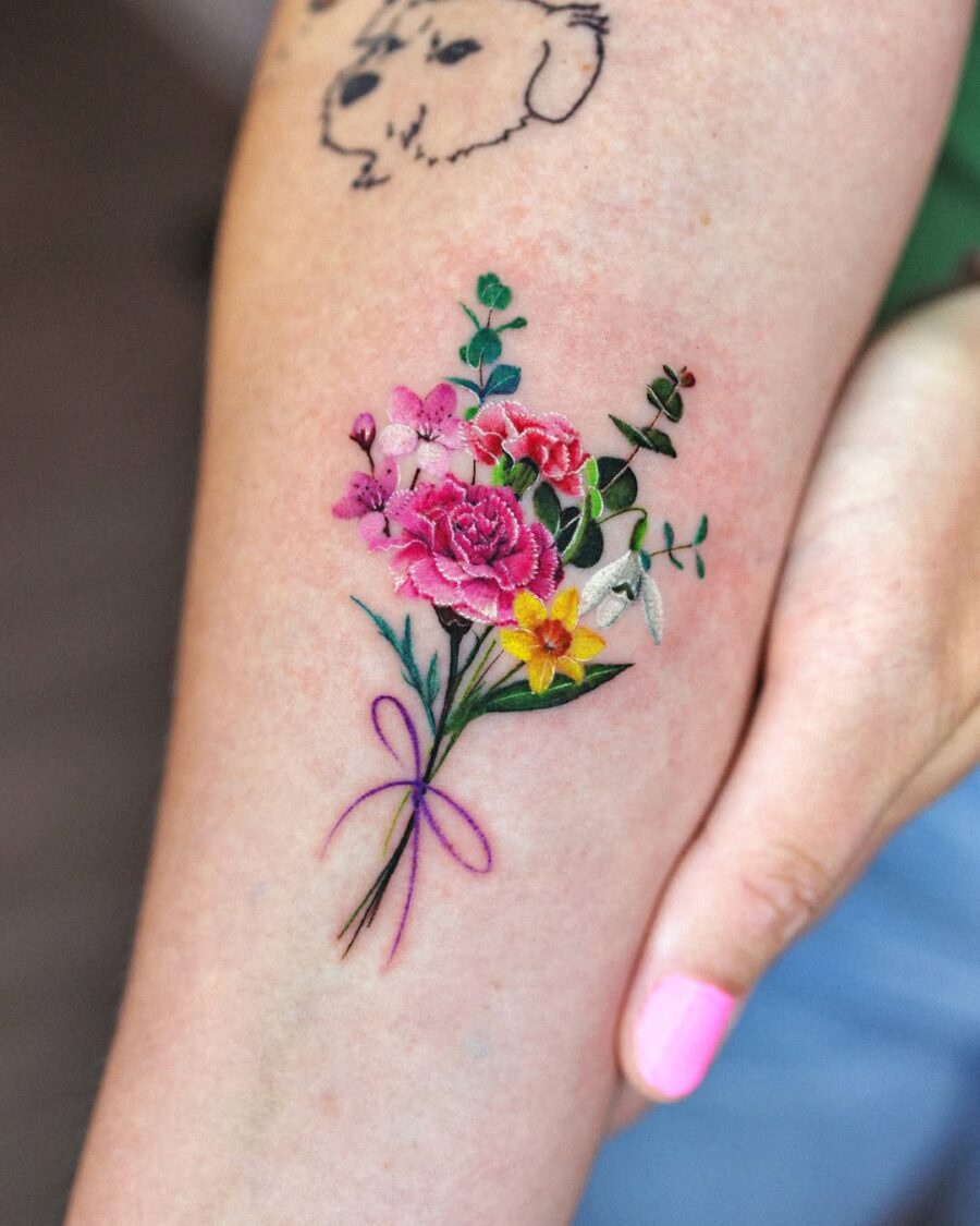 Vibrant bouquet of carnations and lush greens Tattoo on skin