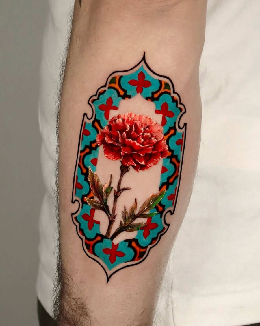 Vibrant carnation surrounded by intricate patterns Tattoo on skin