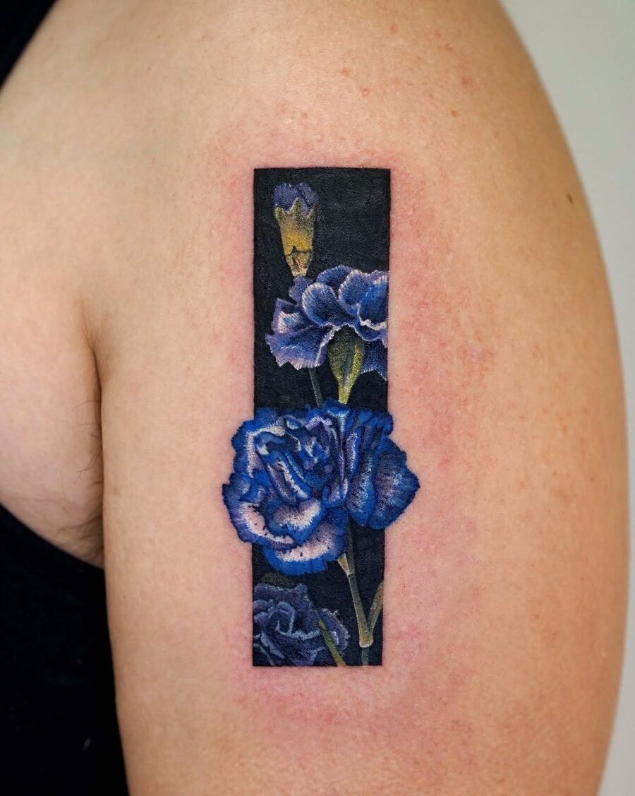 Vibrant Carnation Tattoo with Dark Background Tattoo on skin