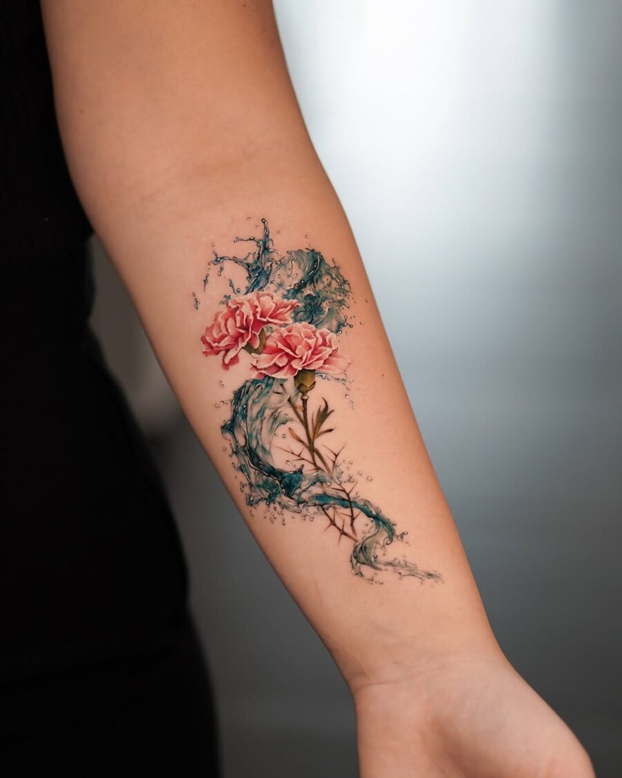 Vivid carnations with a splash of watercolor elegance Tattoo on skin