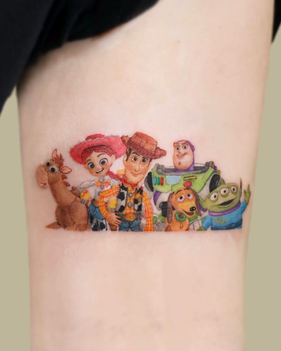 Iconic Toy Story characters in vibrant tattoo art Tattoo on skin