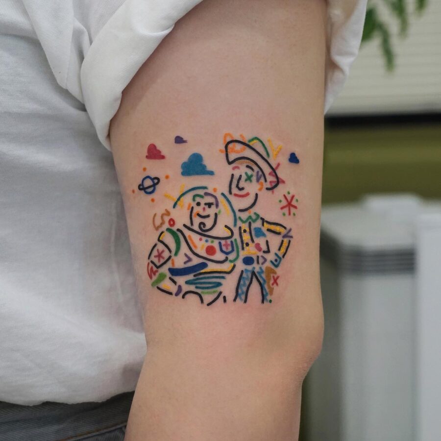 Whimsical Buzz and Woody cartoon tattoo art cartoon tattoos