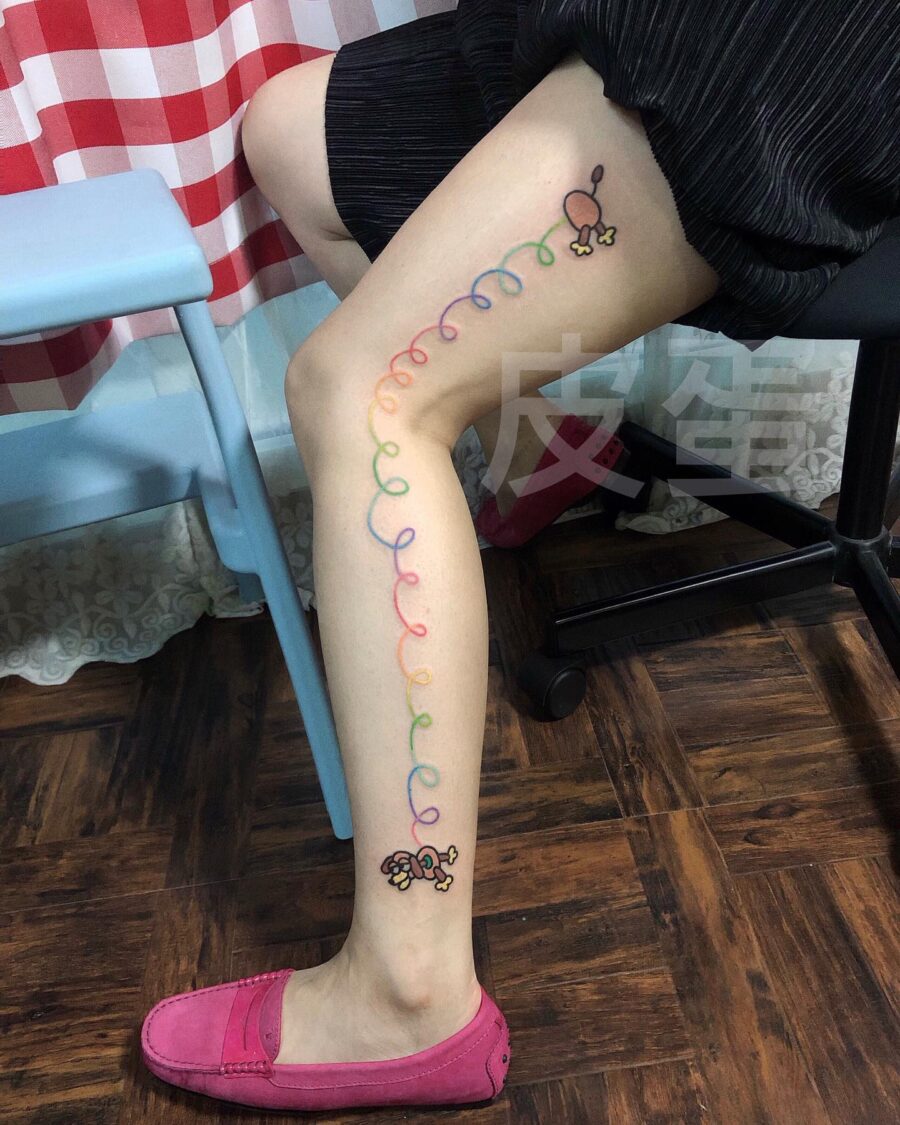 Whimsical cartoon tattoos bring joy to life Tattoo on skin