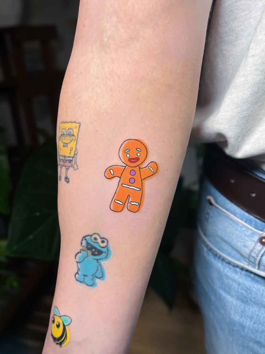 Whimsical cartoon tattoos for playful vibes Tattoo on skin