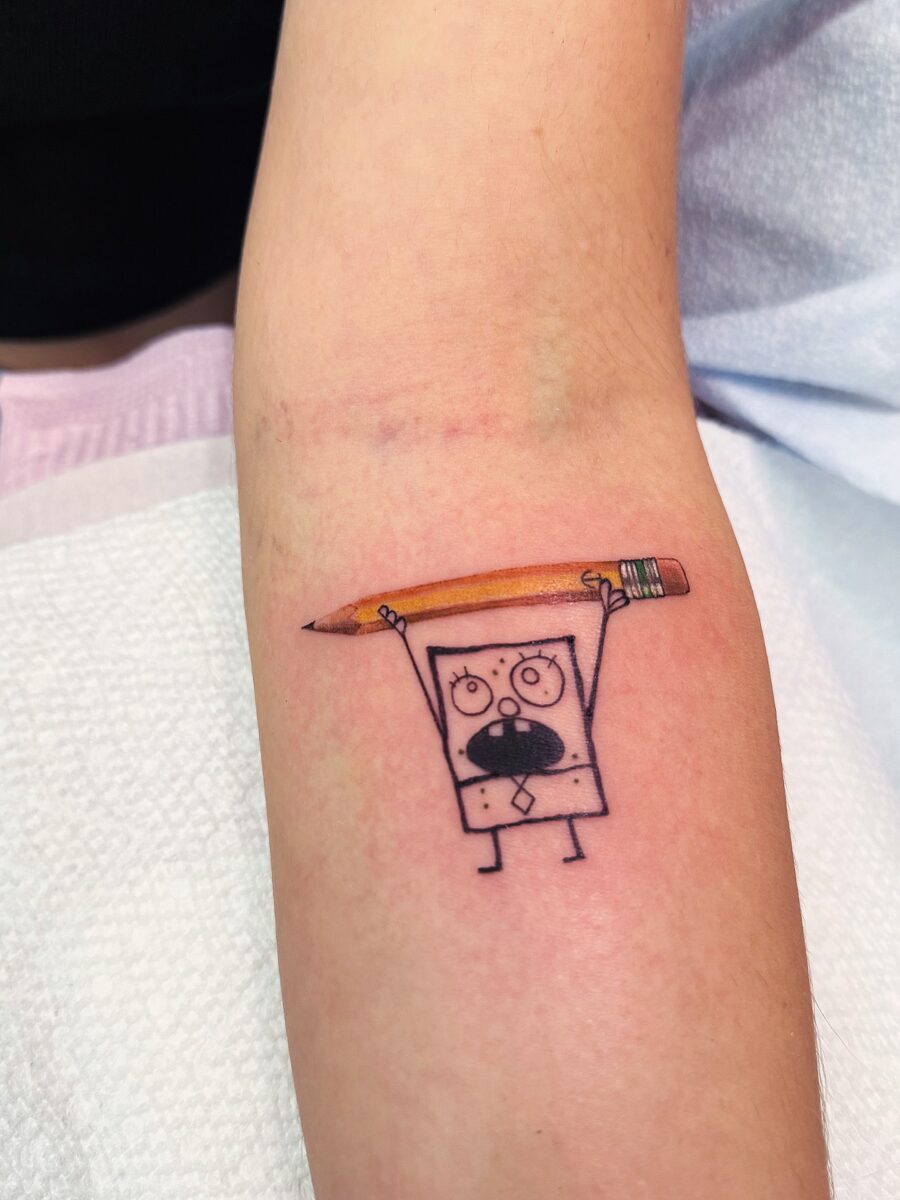 Whimsical SpongeBob Tattoo with Pencil Tattoo on skin