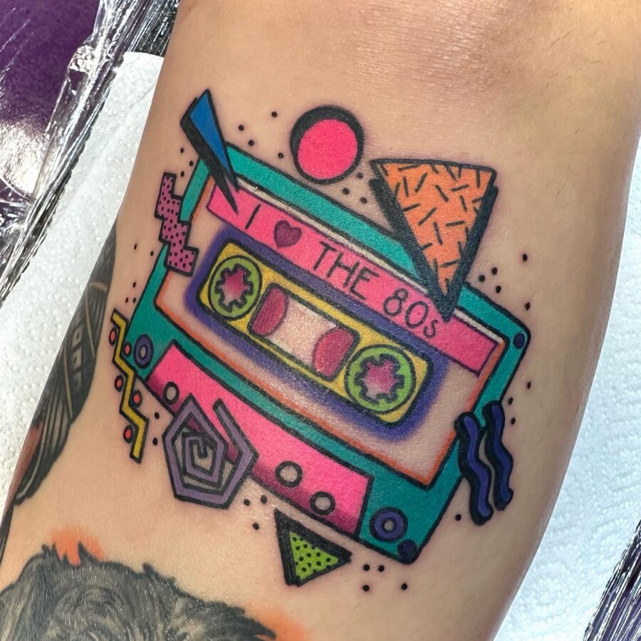 Bold 80s cassette tape with vibrant colors Tattoo on skin