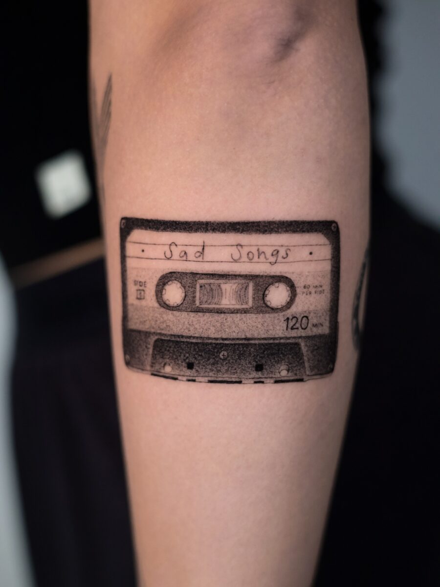 Classic Cassette Tape with Nostalgic Touch Tattoo on skin