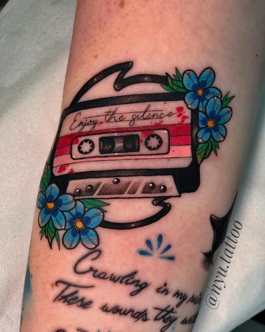Colorful cassette tape design with floral accents Tattoo on skin