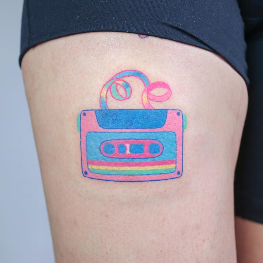 Colorful cassette tape tattoo on thigh Tattoo on skin