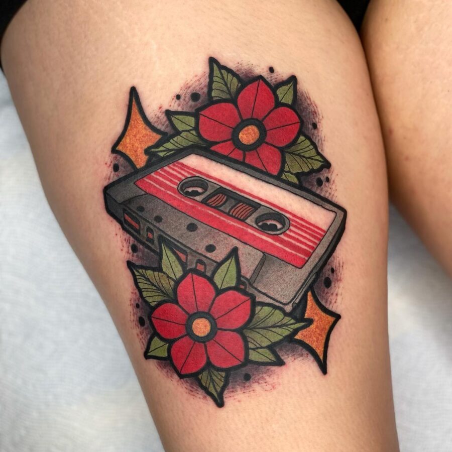 Colorful cassette tape with floral accents Tattoo on skin
