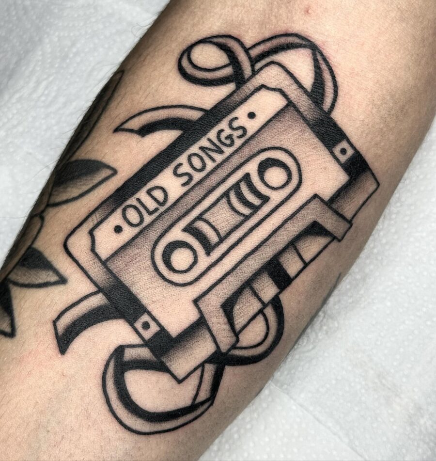 Nostalgic cassette tape tattoo featuring old songs Tattoo on skin