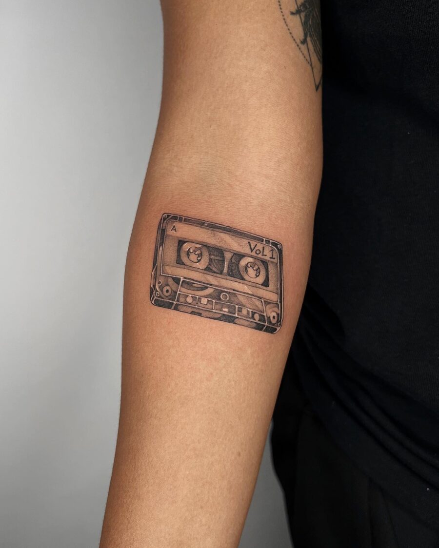 Realistic cassette tape tattoo on forearm Tattoo on skin