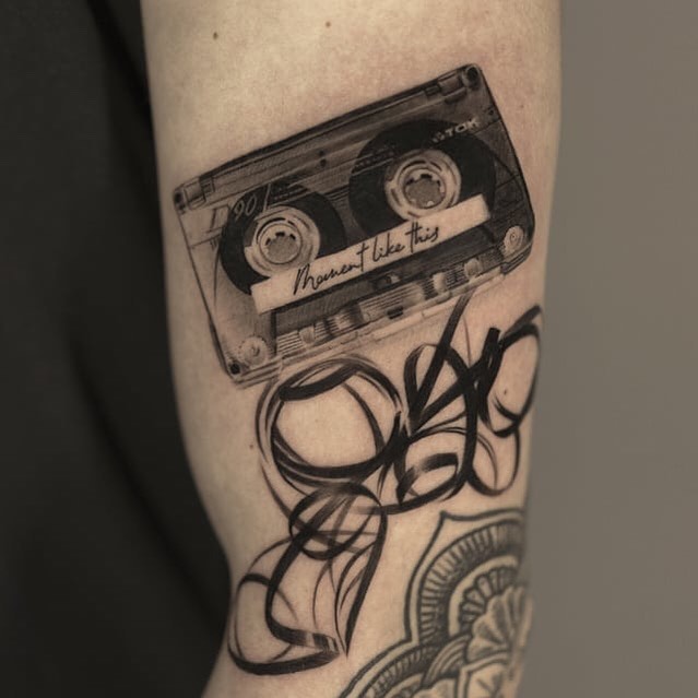 Realistic cassette tape tattoo with artistic flair Tattoo on skin