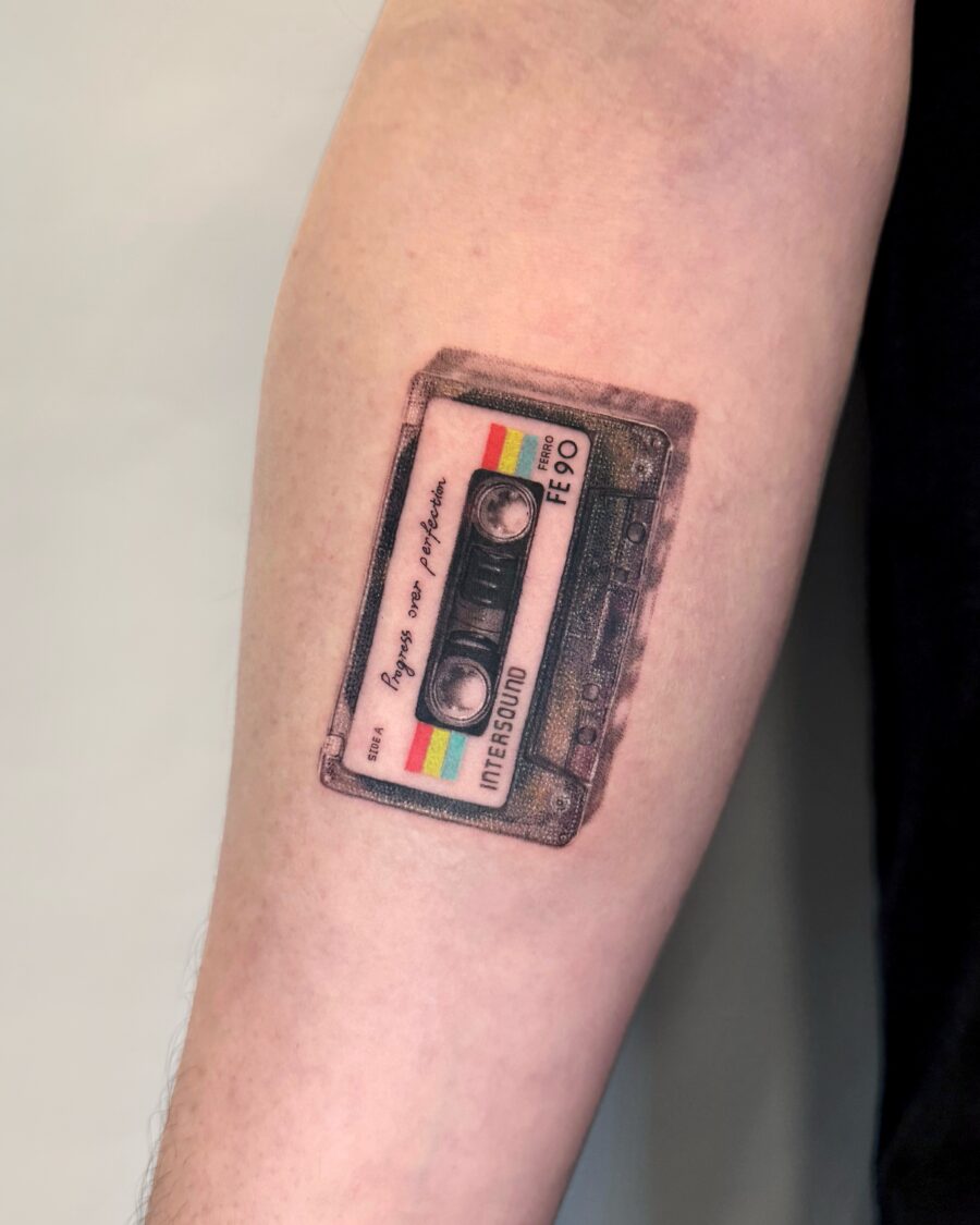 Unique cassette tattoo on forearm. Tattoo on skin