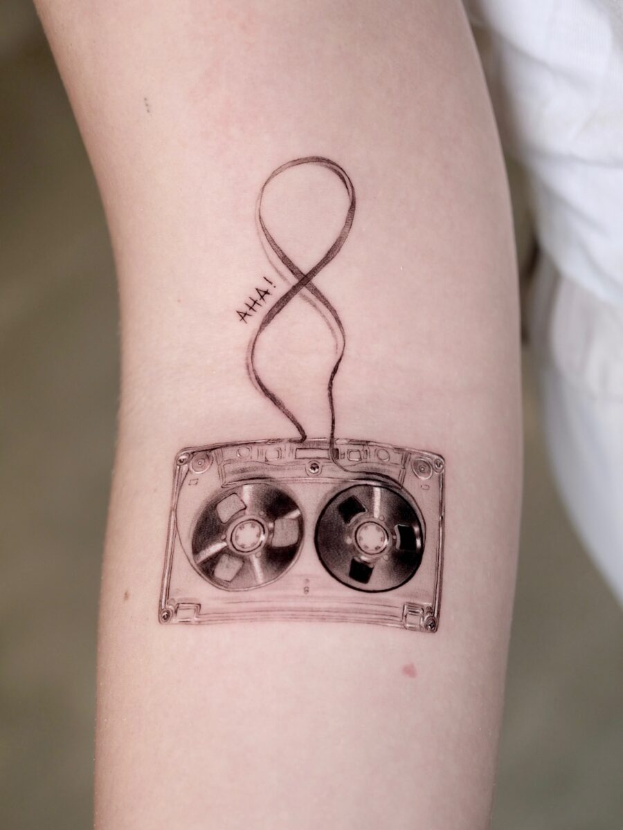 Unique cassette tattoo with infinity design Tattoo on skin
