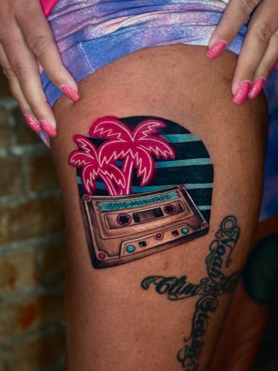 Vibrant cassette tattoo with palm tree vibes Tattoo on skin
