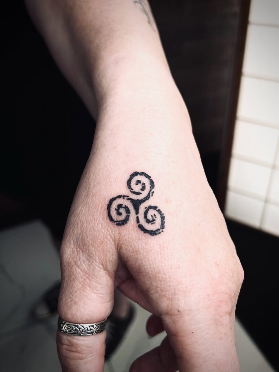 Elegant Celtic swirl tattoo on the hand Tattoo on skin