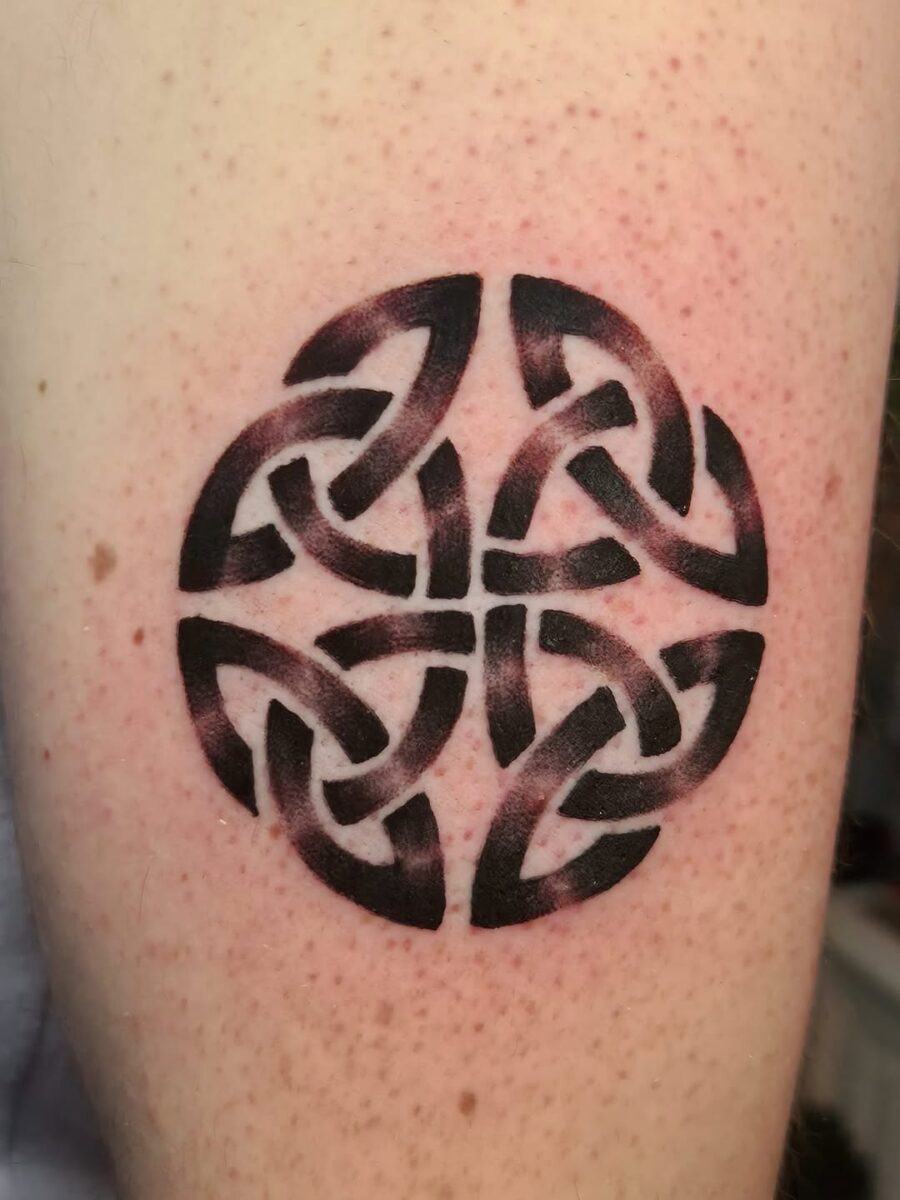 Intricate black ink Celtic circle design Tattoo on skin