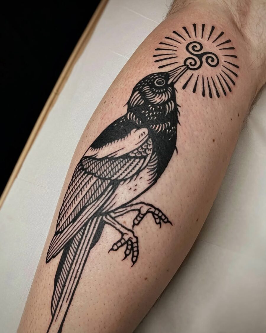 Intricate Celtic bird tattoo with sun symbolism Tattoo on skin