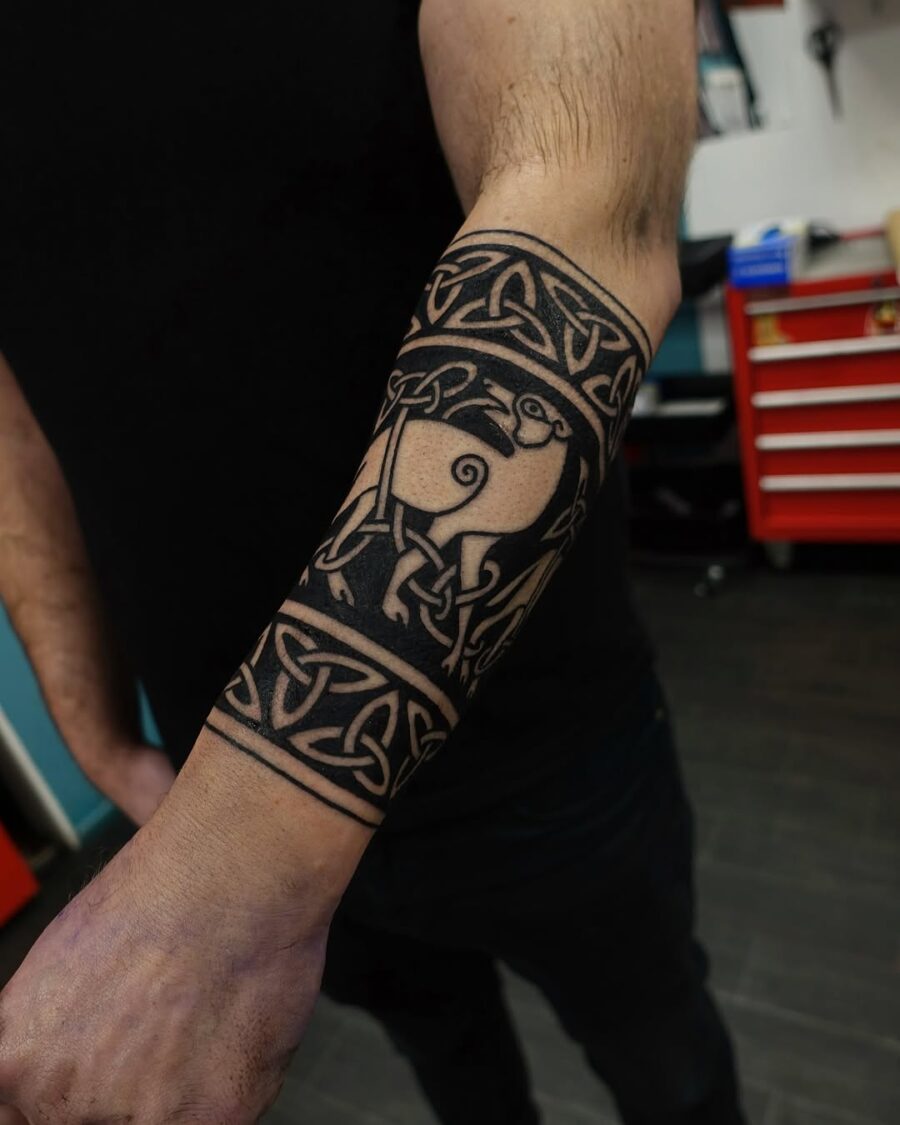 Intricate Celtic designs featuring a sheep motif Tattoo on skin