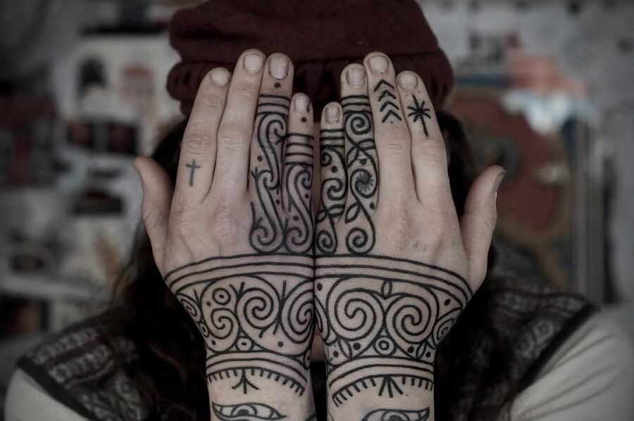 Intricate Celtic designs on hands and wrists Tattoo on skin