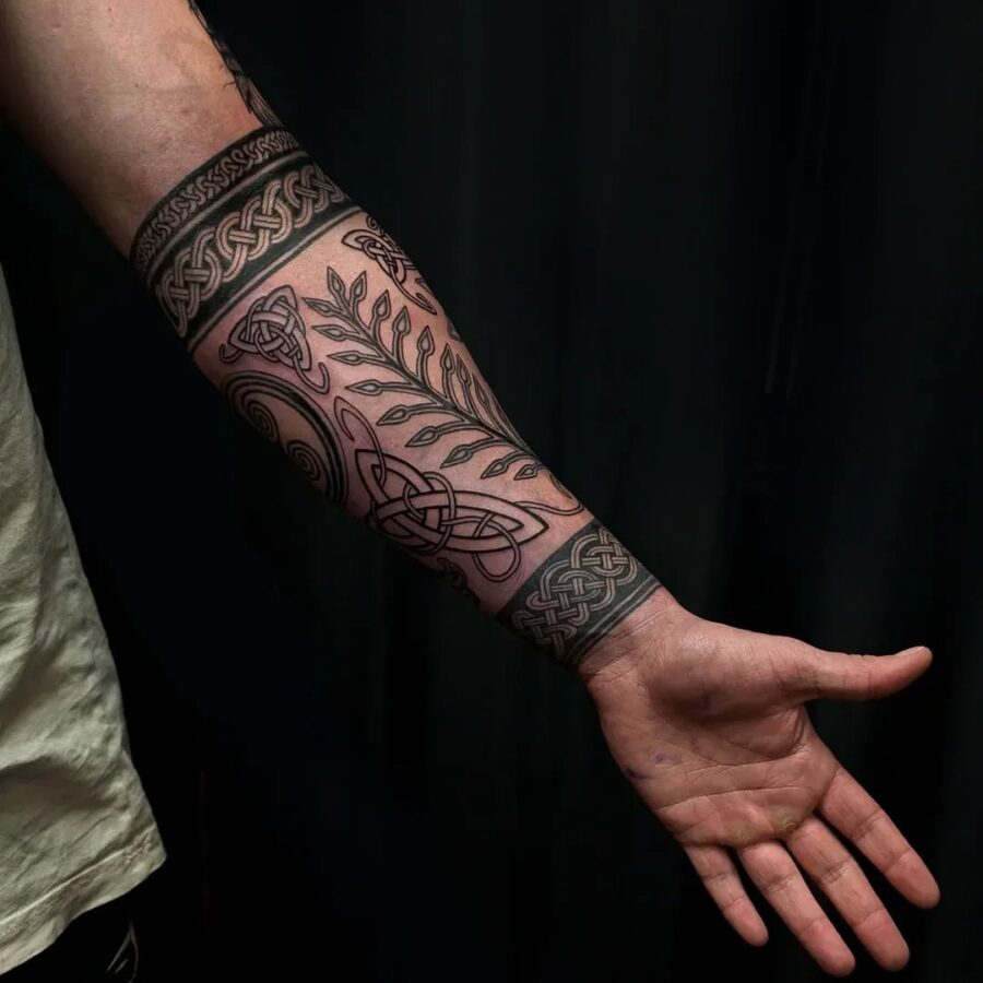 Intricate Celtic Patterns on the Forearm Tattoo on skin