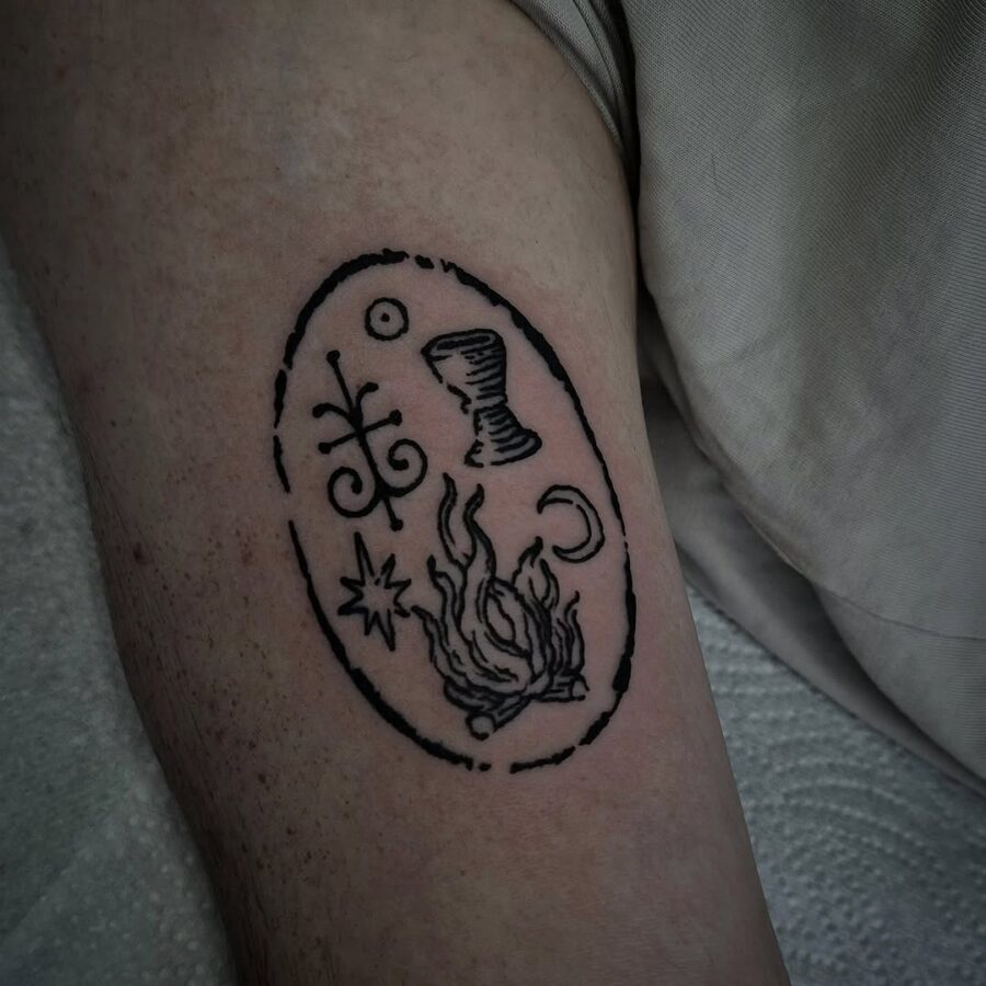 Intricate Celtic symbols in bold outlines Tattoo on skin