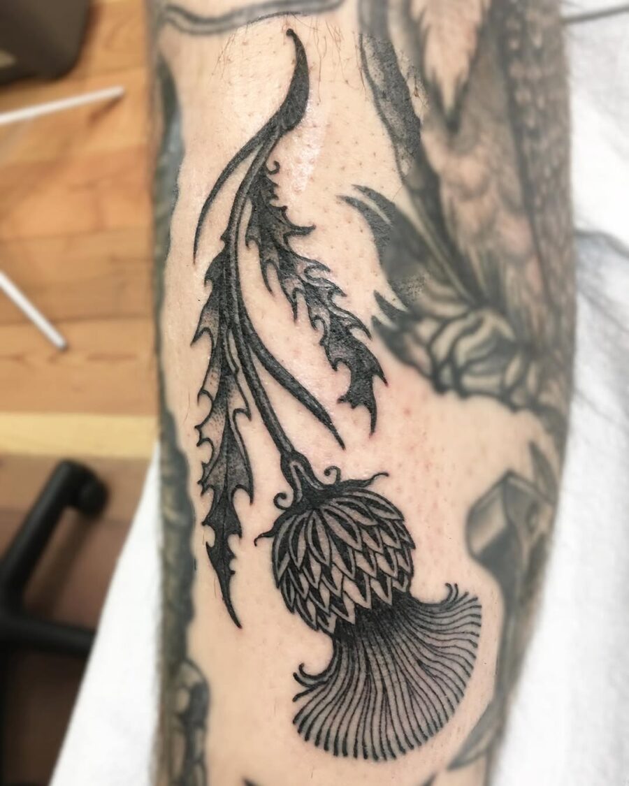 Intricate floral Celtic tattoo design in black ink Tattoo on skin
