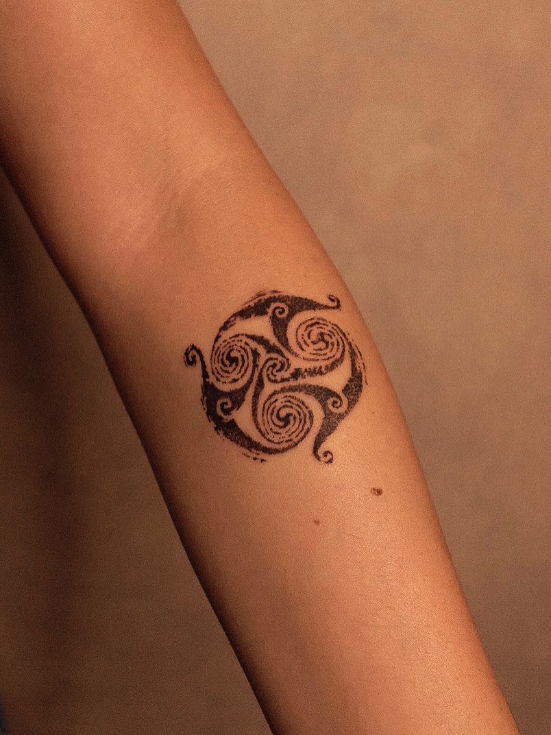 Intricate swirl pattern reflecting Celtic heritage Tattoo on skin