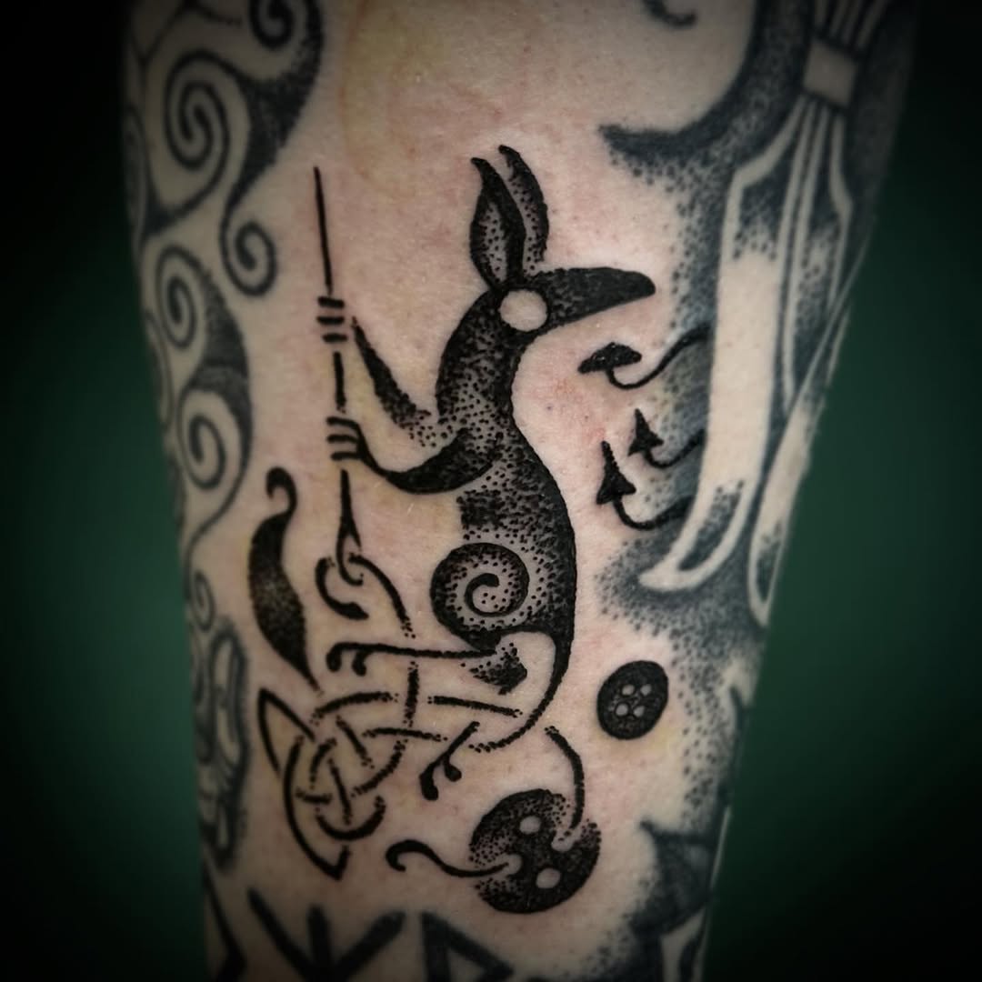 Whimsical Celtic fox tattoo with intricate designs Tattoo on skin