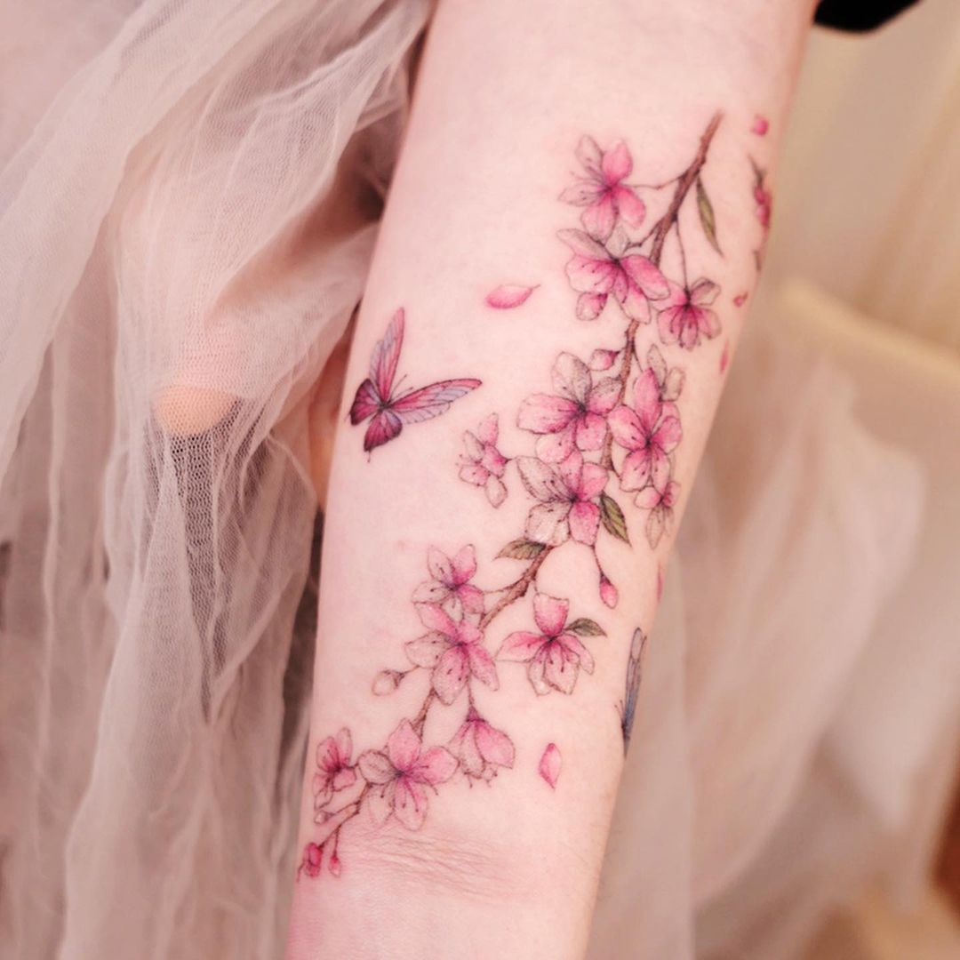 The Blossom Branch with Butterfly Tattoo on skin