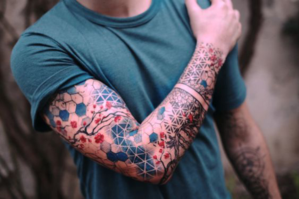 The Geometric-Backed Flower Design Tattoo on skin