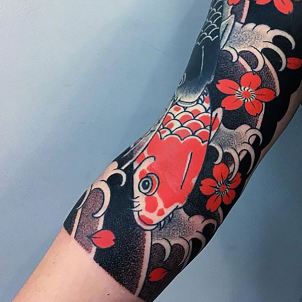 The Koi Fish with Cherry Blossom Tattoo on skin