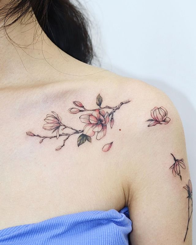 The Pale Pink Cherry Blossom Branch Tattoo on skin