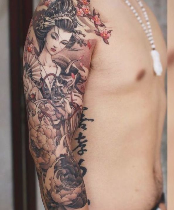 The Serene Geisha Atop the Waves Tattoo on skin