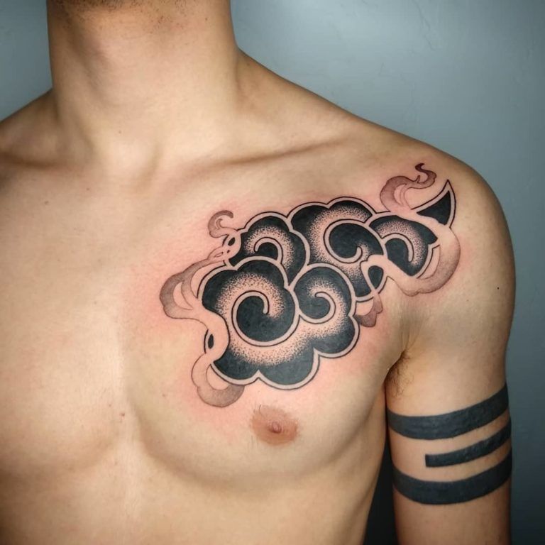 Black and White Tribal Clouds Chest Tattoo Tattoo on skin
