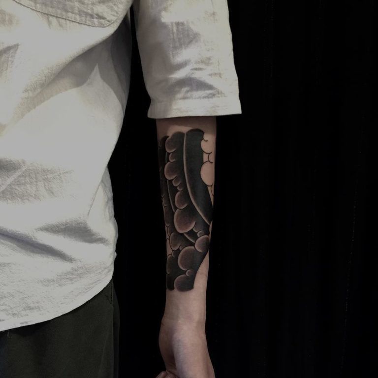 Black Japanese Cloud Tattoos on Forearm Tattoo on skin