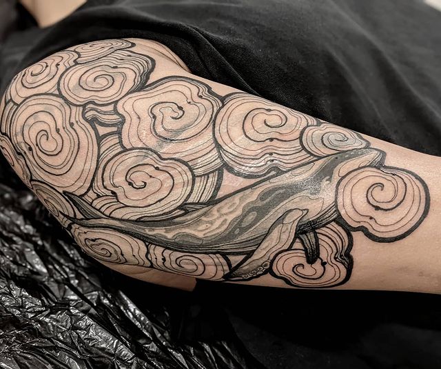 Whale Floating in Clouds Arm Tattoo Tattoo on skin