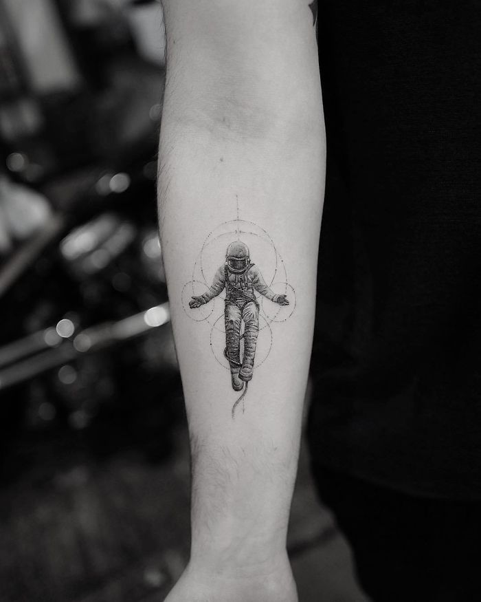 Grayscale Astronaut Photorealistic Arm Tattoo Tattoo on skin
